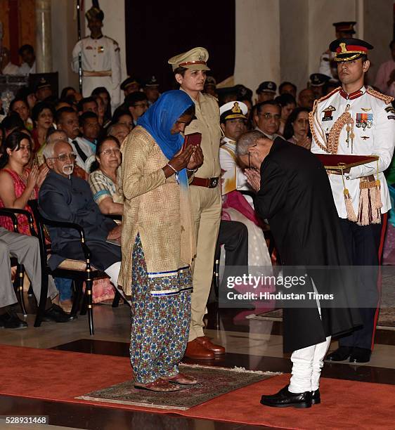 Angrejo Devi, mother of Constable Rocky, receives Shaurya Chakra from President Pranab Mukherjee during a Defence Investiture Ceremony at Rashtrapati...