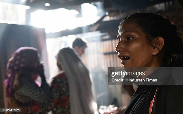 Woman breaks down as her entire room got burnt in a fire at a slum cluster of Gautam Nagar, Govandi on May 6, 2016 in Mumbai, India. Allegedly the...