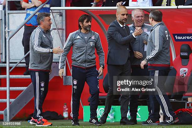 Head coach Pep Guardiola of Muenchen and staff members celebrate being Bundesliga champions after beating Ingolstadt 2-1 in the Bundesliga match...