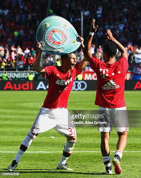 Joshua Kimmich and Thiago Alcantara of Muenchen celebrate being Bundesliga champions after beating Ingolstadt 2-1 in the Bundesliga match between FC...