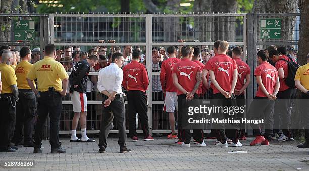 The players of Stuttgart discuss with fans at the stadium exit after the Bundesliga match between VfB Stuttgart and 1. FSV Mainz 05 at Mercedes-Benz...