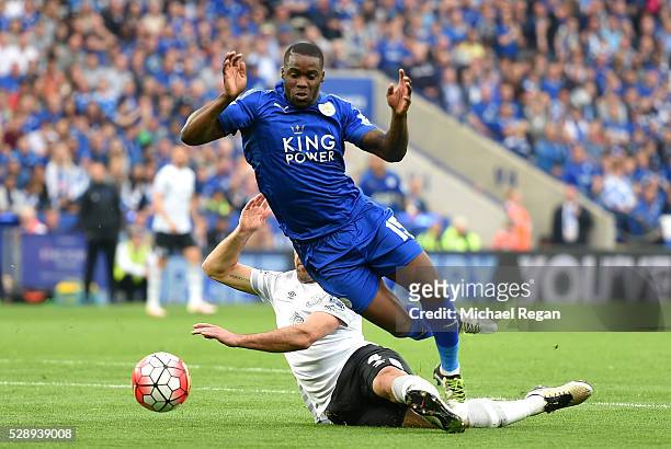 Jeff Schlupp of Leicester City is fouled by Darron Gibson of Everton resulting in a penalty kick during the Barclays Premier League match between...