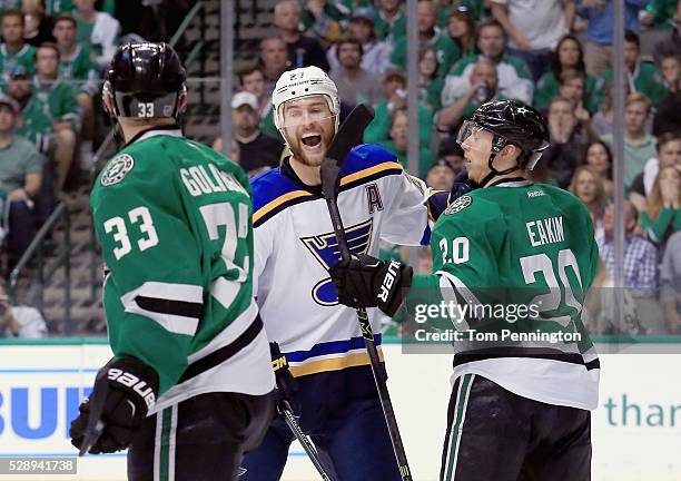 Alex Pietrangelo of the St. Louis Blues celebrates as Alex Goligoski of the Dallas Stars and Cody Eakin of the Dallas Stars look on after the Blues...