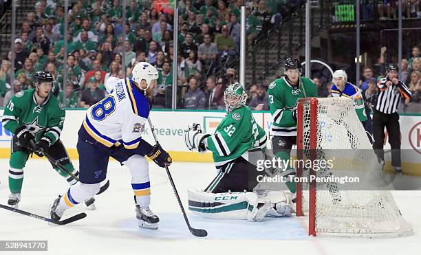 Kyle Brodziak of the St. Louis Blues looks to rebound the puck as Kari Lehtonen of the Dallas Stars gives up a goal against the Blues in the second...