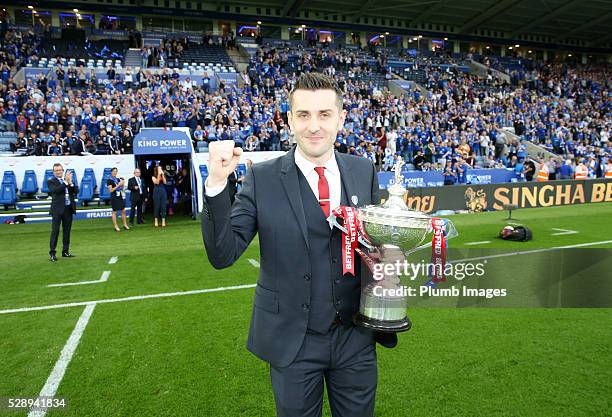 World Snooker Champion Mark Selby shows off his trophy during the Barclays Premier League match between Leicester City and Everton at the King Power...