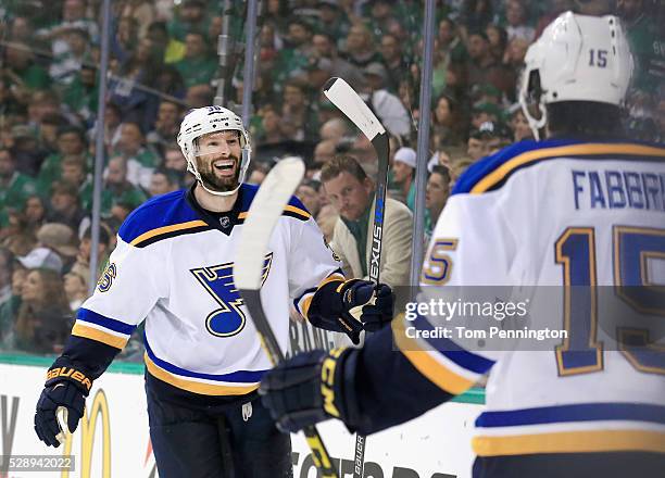 Troy Brouwer of the St. Louis Blues celebrates with Robby Fabbri of the St. Louis Blues after scoring a goal against Kari Lehtonen of the Dallas...