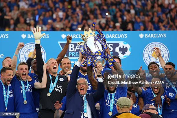 Wes Morgan and Manager/Head Coach of Leicester City Claudio Ranieri lift the Premier League Trophy as Leicester City celebrate becoming Premier...