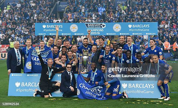 Leicester City players celebrate the season champions with the Premier League Trophy after the Barclays Premier League match between Leicester City...