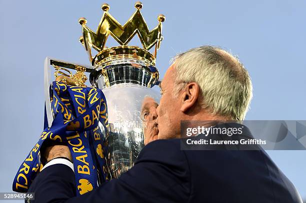 Claudio Ranieri Manager of Leicester City kisses the Premier League Trophy after the Barclays Premier League match between Leicester City and Everton...