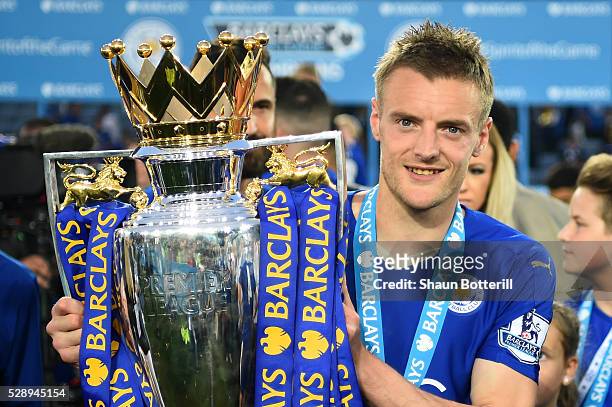 Jamie Vardy of Leicester City poses for photographs wit the Premier League Trophy after the Barclays Premier League match between Leicester City and...