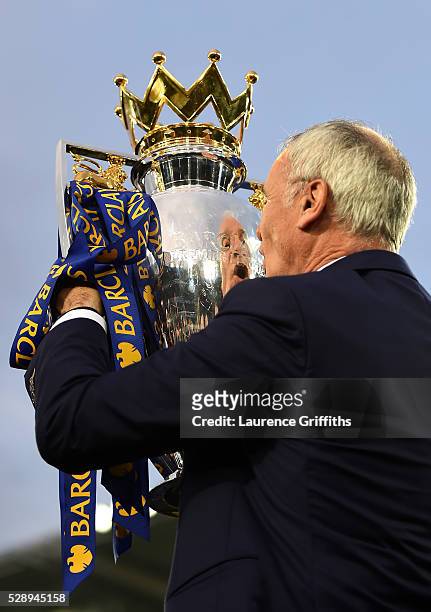 Claudio Ranieri Manager of Leicester City kisses the Premier League Trophy after the Barclays Premier League match between Leicester City and Everton...