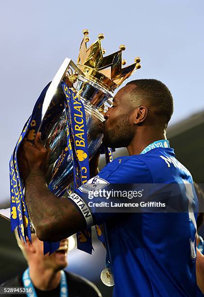 Wes Morgan of Leicester City kisses the Premier League Trophy as players and staffs celebrate the season champions after the Barclays Premier League...