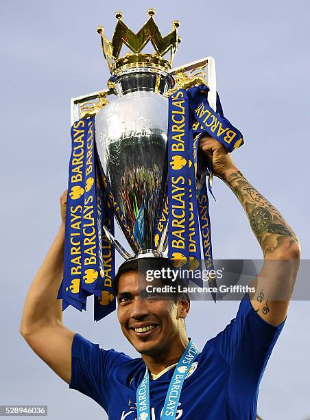 Leonardo Ulloa of Leicester City lifts the Premier League Trophy as players and staffs celebrate the season champions after the Barclays Premier...