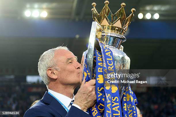 Claudio Ranieri Manager of Leicester City kisses the Premier League Trophy after the Barclays Premier League match between Leicester City and Everton...