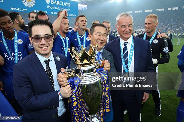 Chairman Vichai Srivaddhanaprabha and Vice chairman Aiyawatt Srivaddhanaprabha of Leicester City lift the Premier League trophy after the Barclays...