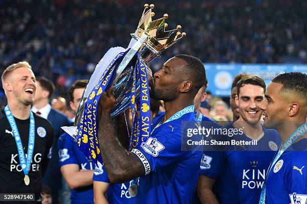 Wes Morgan of Leicester City kisses the Premier League Trophy as players and staffs celebrate the season champions after the Barclays Premier League...
