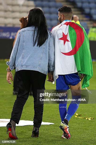 Riyad Mahrez of Leicester City walks with wife Rita, as Leicester City celebrate becoming Premier League Champions for the 2015/16 Season at the end...