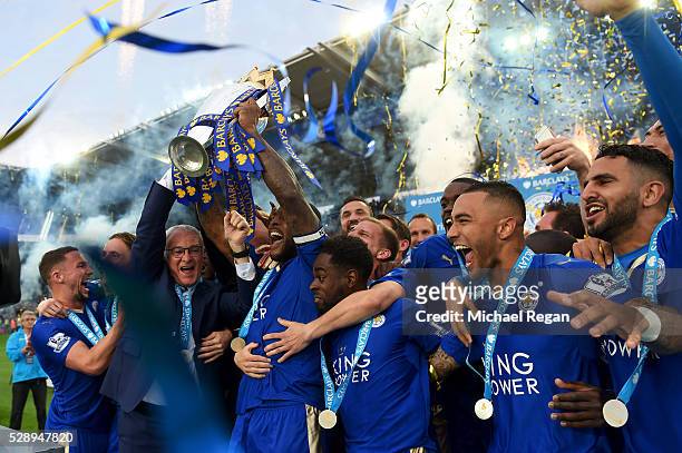 Captain Wes Morgan and manager Claudio Ranieri of Leicester City lift the Premier League Trophy after the Barclays Premier League match between...