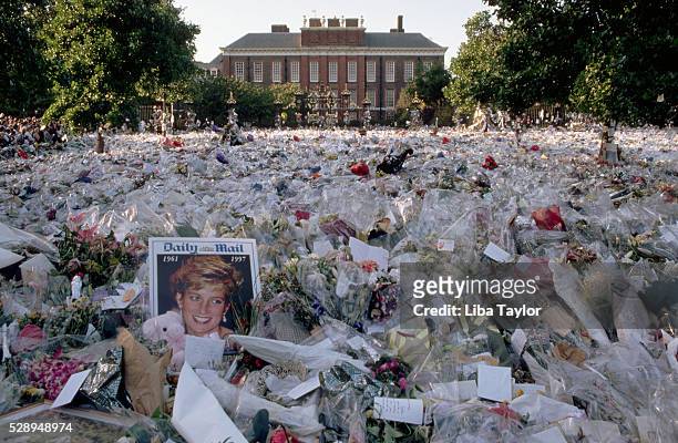 Multi-colored sea of floral tributes to Diana, Princess of Wales, lie outside the gates of her London home. The flowers began to arrive soon after...