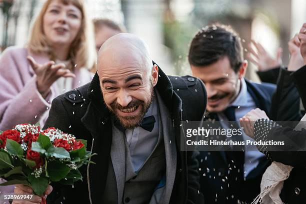 Throwing Rice On Gay Couple After Wedding Ceremony