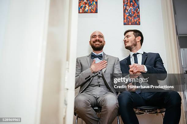 gay couple waiting excited for wedding ceremony - wedding ceremony alter stock pictures, royalty-free photos & images