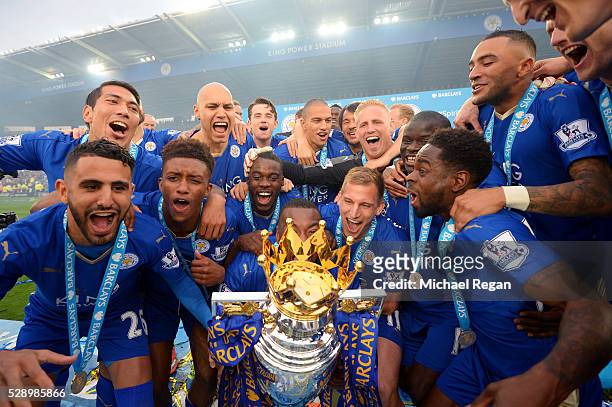Captain Wes Morgan of Leicester City to lift the Premier League Trophy as players celebrate the season champions after the Barclays Premier League...