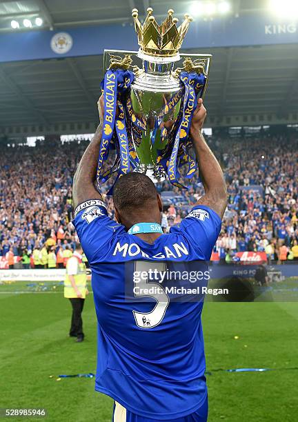 Wes Morgan of Leicester City lifts the Premier League Trophy as players and staffs celebrate the season champion after the Barclays Premier League...