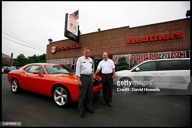 Larry Weathers III with his father Larry Jnr. In front of Weathers Dodge, which his family has run for 87 years in Lima, Pennsylvania. Weathers is...