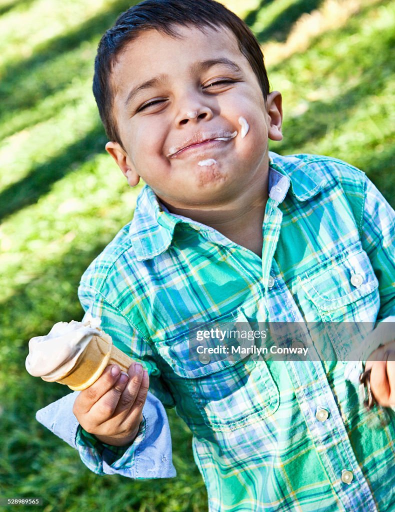 Hispanic boy eating ice cream