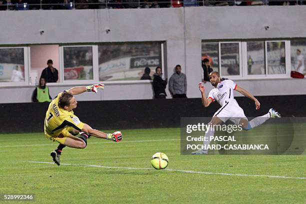 Paris Saint-Germain's Lucas Moura shoots the ball in front of Ajaccio's French goalkeeper Clement Maury during the L1 football match Gazelec Ajaccio...
