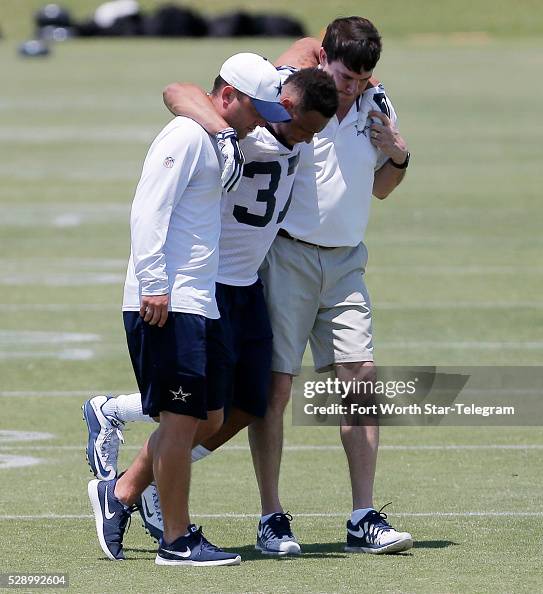 Dallas Cowboys cornerback Jeremiah McKinnon is helped off the field Dallas Cowboys cornerback Jeremiah McKinnon is helped off the field