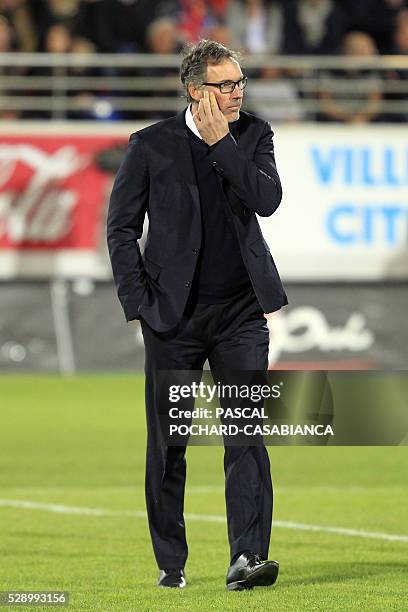 Paris Saint-Germain's French head coach Laurent Blanc walks on the field before the L1 football match Gazelec Ajaccio against Paris Saint Germain on...