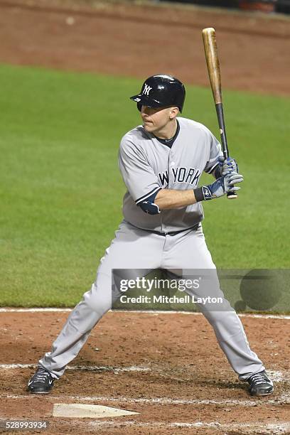 Dustin Ackley of the New York Yankees prepares for a pitch during a baseball game against the Baltimore Orioles at Oriole Park at Camden Yards on May...