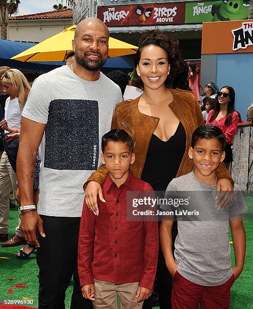 Derek Fisher, Gloria Govan and sons Carter Kelly Barnes and Isaiah Michael Barnes attend the premiere of "Angry Birds" at Regency Village Theatre on...