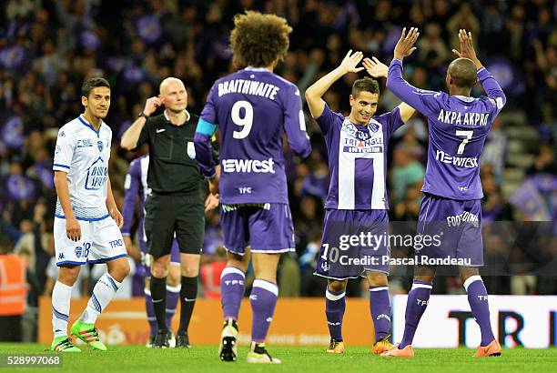 Wissam Ben Yedder from Toulouse celebrates his victory with team mate Jean Daniel Akpa Akpro at the end of the match between Toulouse v Troyes> at...