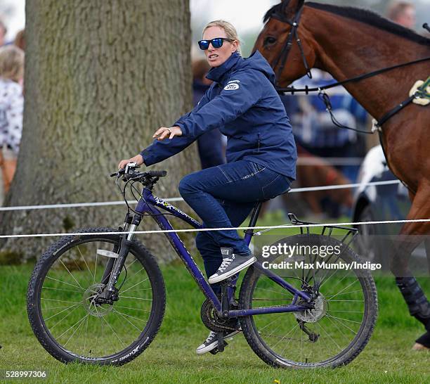 Zara Tindall rides her pushbike around the Badminton Horse Trials before competing in the cross country phase of the event on May 7, 2016 in...