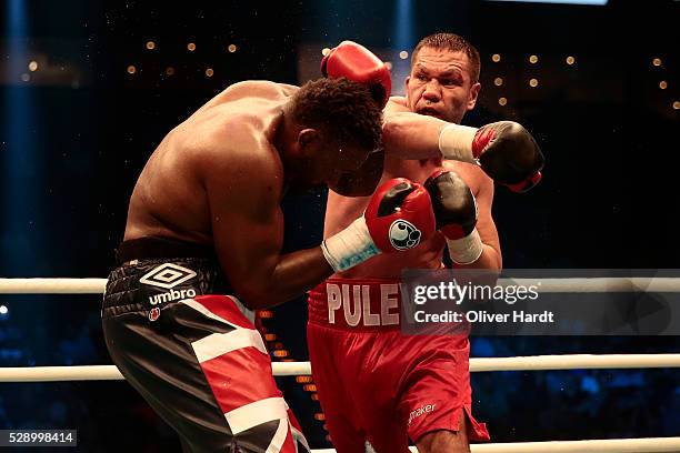 Kubrat Pulev of Bulgaria throws a punch at Dereck Chisora of Great Britain during Heavyweight European Championship between Kubrat Pulev and Dereck...