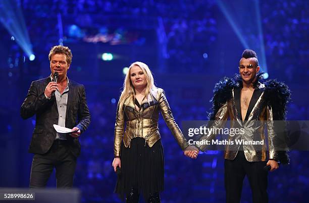 Oliver Geissen, Laura van den Elzen and Prince Damien are waiting for the final decision about the winner during the finals of the television show...