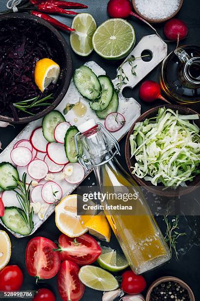 homemade vinaigrette and salad ingredients, salad dressing with fresh vegetables, top view - vinaigrette dressing ストックフォトと画像