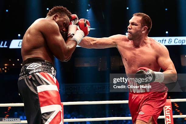 Kubrat Pulev of Bulgaria throws a punch at Dereck Chisora of Great Britain during Heavyweight European Championship between Kubrat Pulev and Dereck...