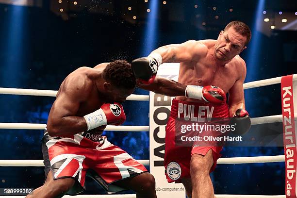 Kubrat Pulev of Bulgaria throws a punch at Dereck Chisora of Great Britain during Heavyweight European Championship between Kubrat Pulev and Dereck...