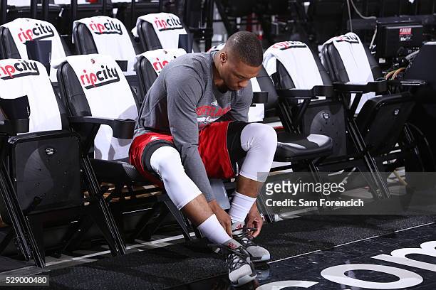 Damian Lillard of the Portland Trail Blazers prepares before the game against the Golden State Warriors in Game Three of the Western Conference...