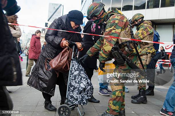 Brussels 23 March 2016.Soldiers check everyone who wants to use the subway, at underground entrance De Brouckere in the center of Brussels