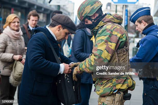 Brussels 23 March 2016.Soldiers check everyone who wants to use the subway, at underground entrance De Brouckere in the center of Brussels