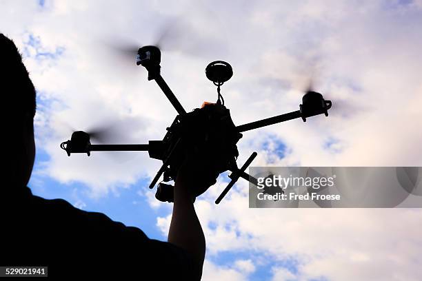 flying drone, octocopter - octocopter stock pictures, royalty-free photos & images
