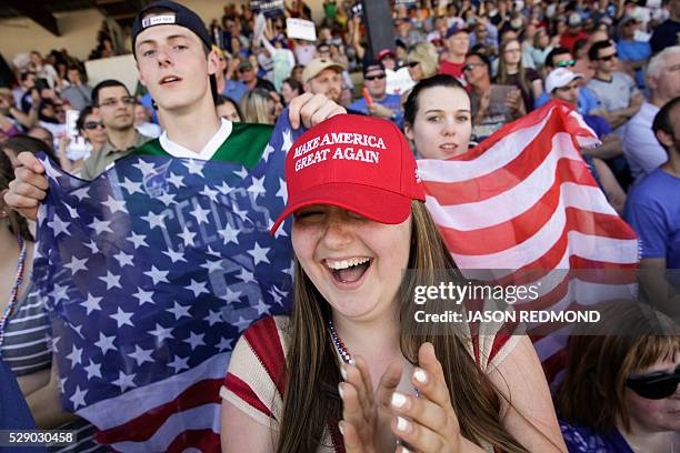 Glory DeCoteau Sean Graham and his sister Colleen Graham cheer as US Republican presidential candidate Donald Trump speaks during a campaign stop at...