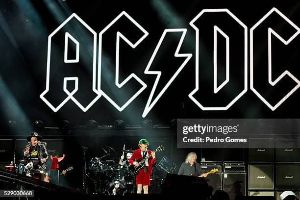 Axl Rose and Angus Young of AC/DC perform the first concert of the Rock or Bust tour at the Passeio Maritimo De Alges on May 7, 2016 in Lisbon,...