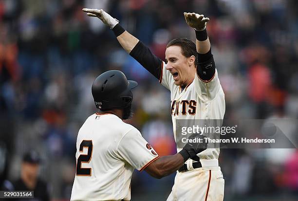 Matt Duffy and Denard Span of the San Francisco Giants celebrates after Duffy hit a walk off game winning rbi single scoring Conor Gillaspie against...