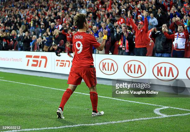 Tsubasa Endoh of Toronto FC celebrates a goal during the first half of an MLS soccer game against FC Dallas at BMO Field on May 7, 2016 in Toronto,...