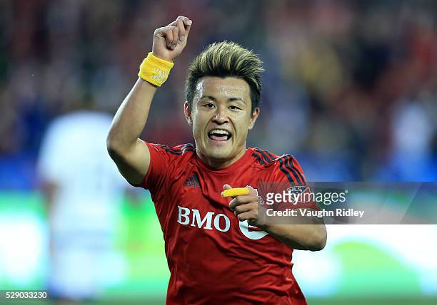 Tsubasa Endoh of Toronto FC celebrates a goal during the first half of an MLS soccer game against FC Dallas at BMO Field on May 7, 2016 in Toronto,...